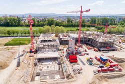 Runde Treppenkerne und Fassadenschotten prägen den Neubau «GRID»